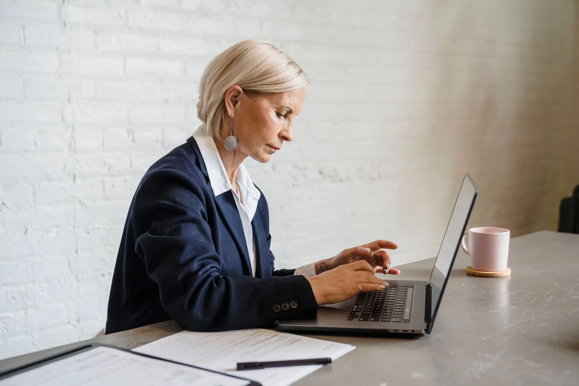 A professional working on her laptop